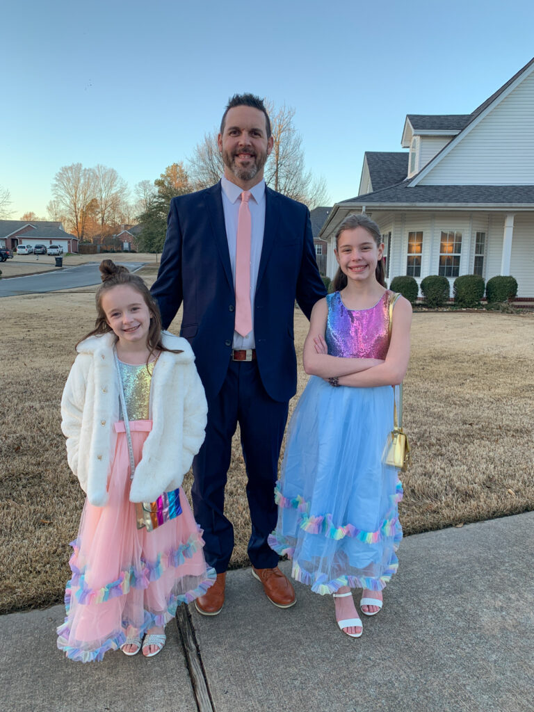feature photo Arkansas Girls, Norah and Harper, with their dad in their Daddy Daughter Dance outfits