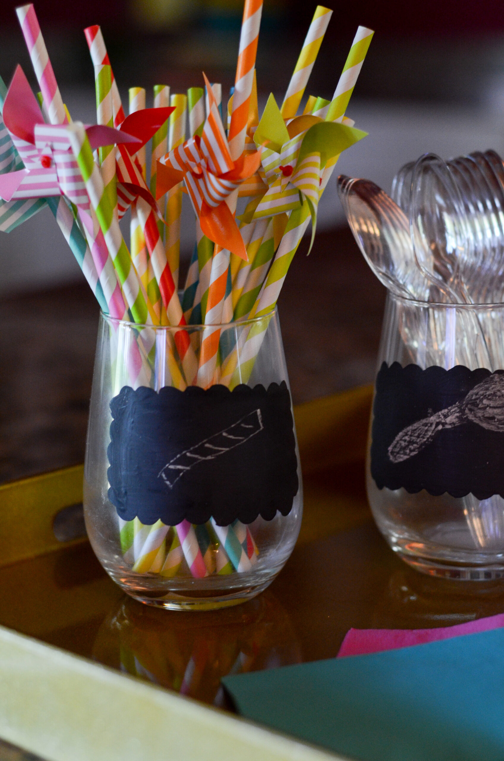glass of pretty straws for party