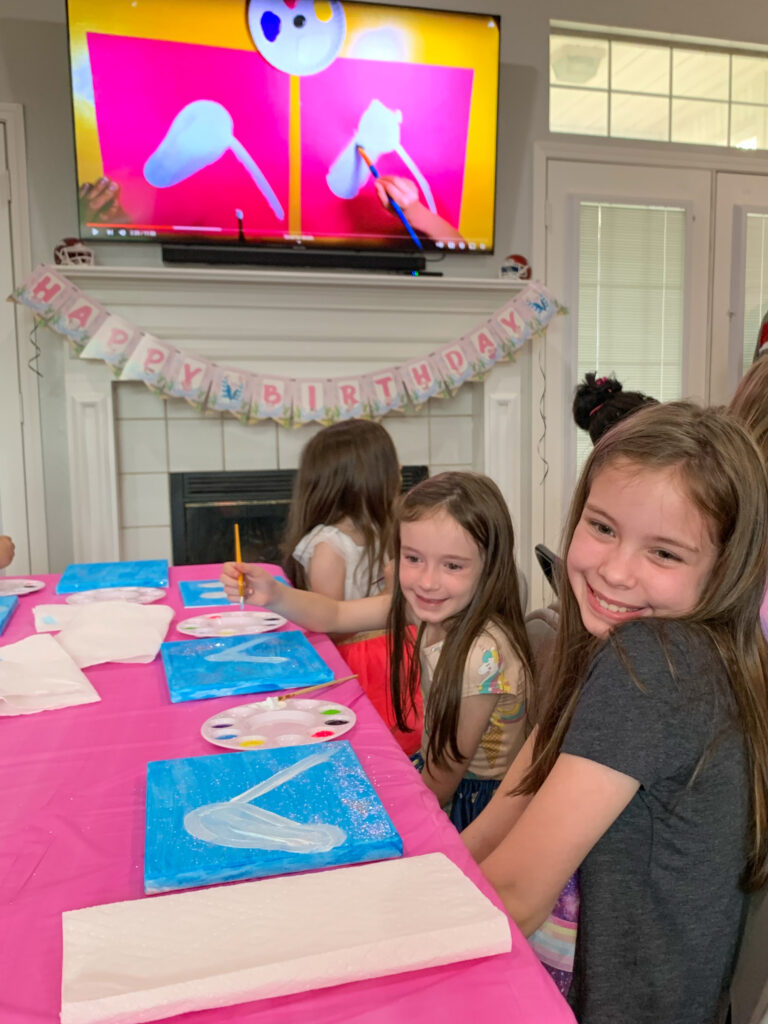Arkansas kid bloggers, Norah and Harper, at a unicorn paint party for their cousin
