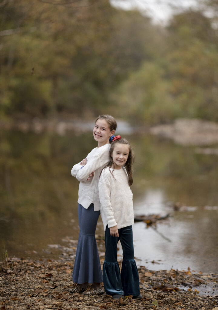 Arkansas kid bloggers, Harper and Norah of Arkansas Girls, stand at the Saline River