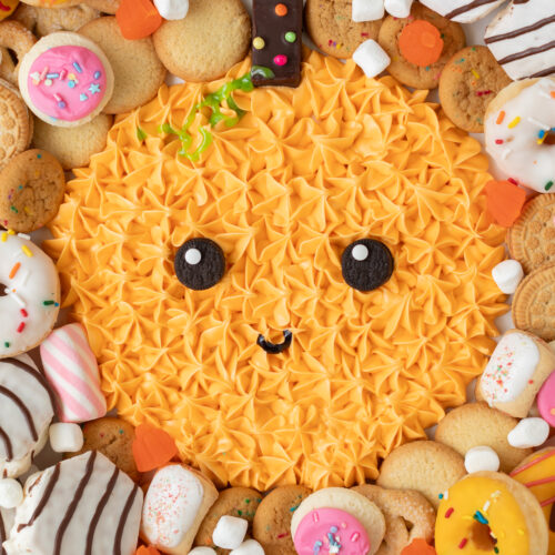 dessert board with pumpkin frosting and sweets for kids