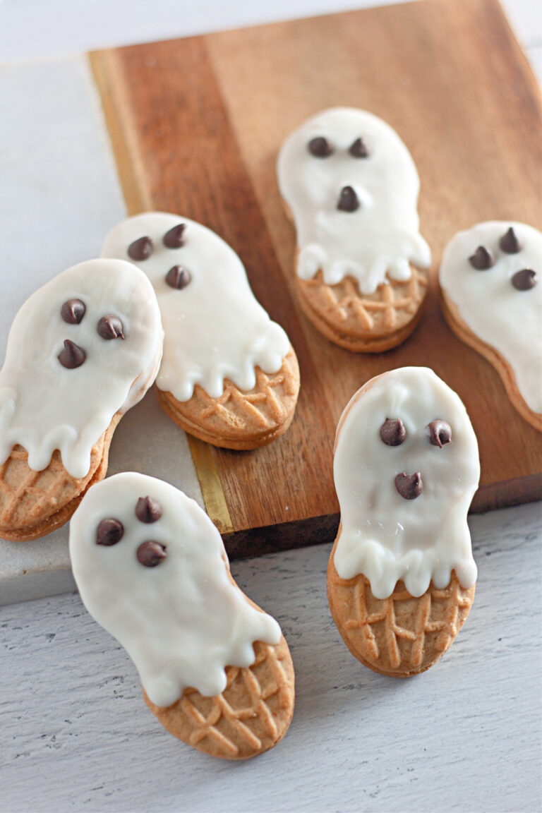 Nutter Butter ghosts on a wood cutting board