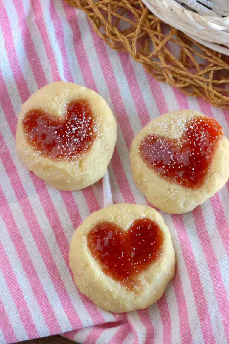 heart thumbprint cookies on pink cloth