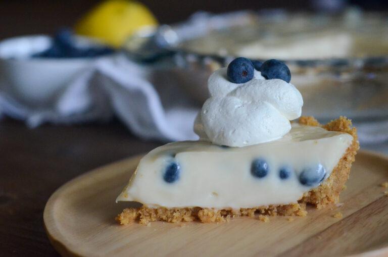 slice of lemon blueberry cream pie on round platter