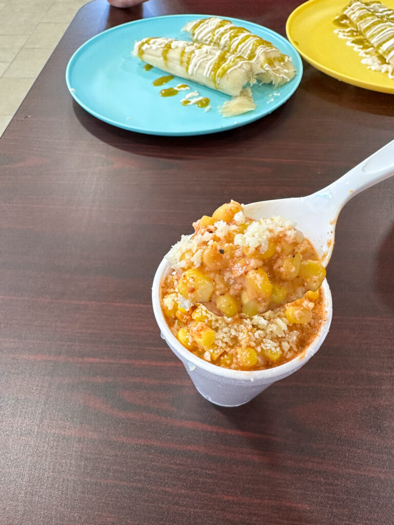 elote and tamales on table