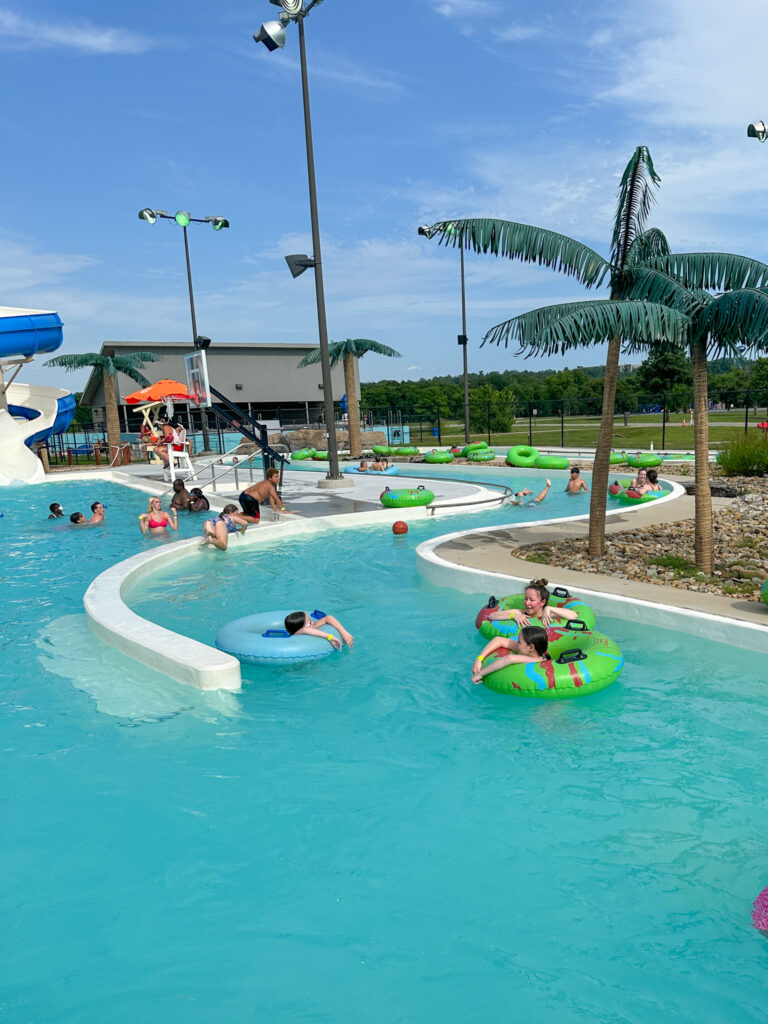 family on floats in the Crocodile Creek lazy river at Parrot Island Waterpark in Fort Smith, Arkansas