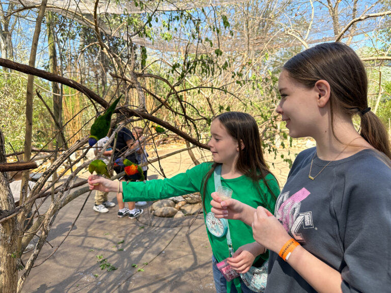 girls with lorakeets at Nashville Zoo