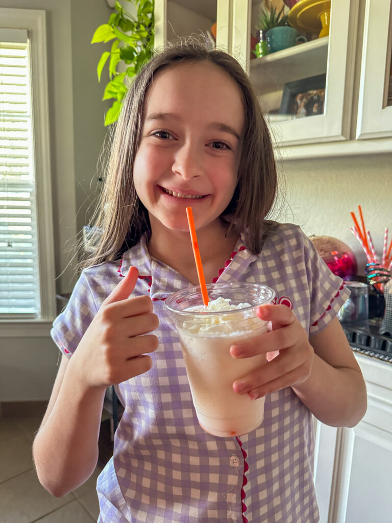 Arkansas blogger, Norah from Arkansas Girls Blog, holds her Halloween dirty soda